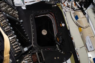 Photo of the Moon, as it drew close in the window of the Orion spacecraft